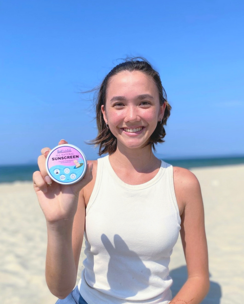 Ailie holding SurfaBabe sunscreen